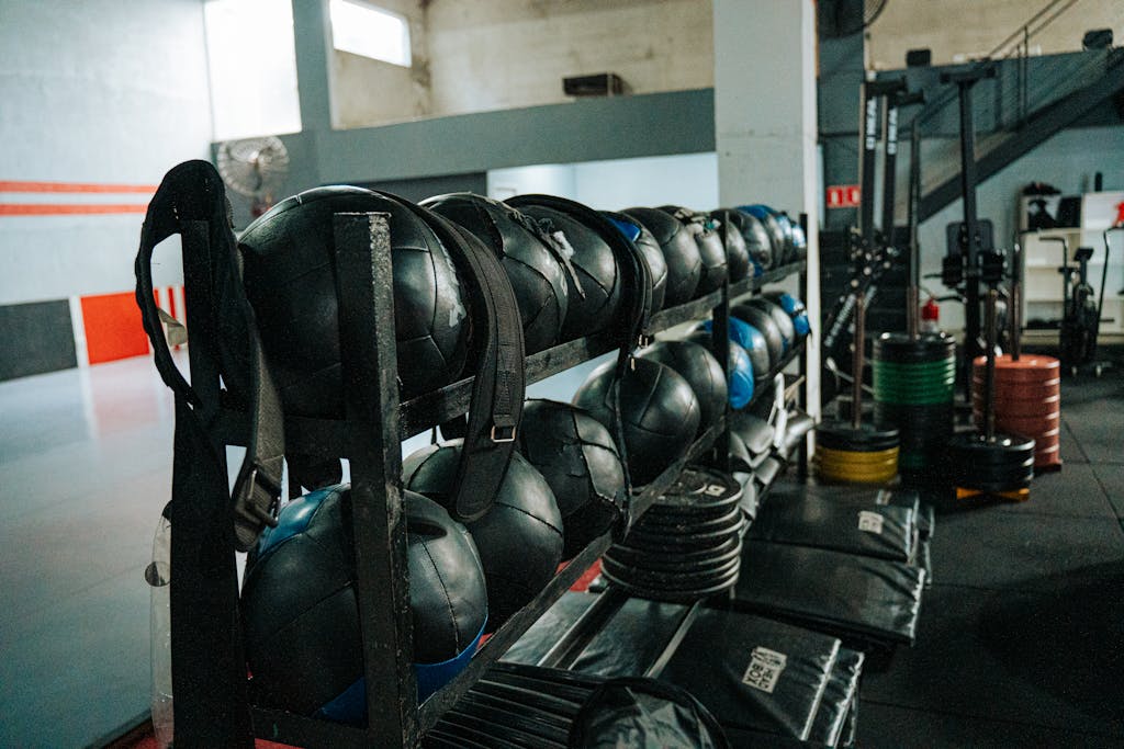 Well-equipped indoor gym featuring kettlebells, weights, and workout gear, perfect for fitness enthusiasts.