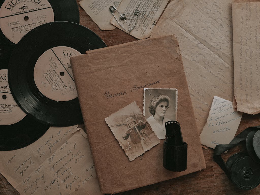 A nostalgic still life with vintage records, photos, and letters, evoking memories from the past.