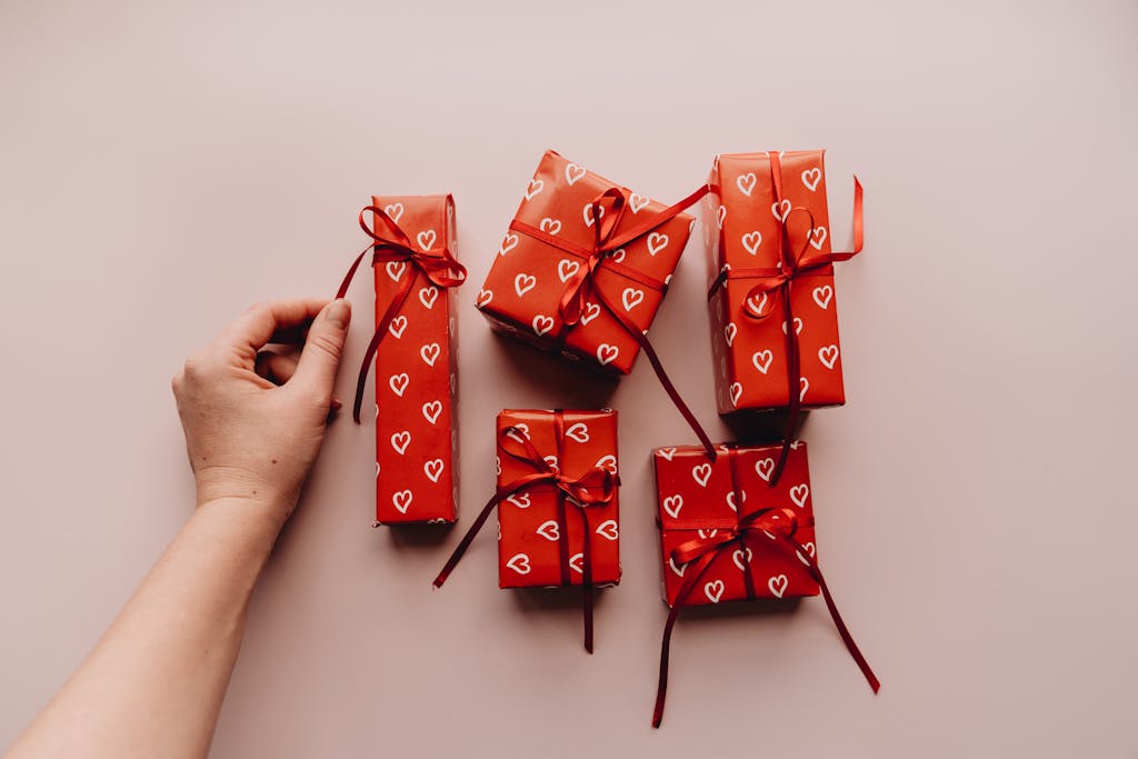 Red presents with heart patterns and ribbons, perfect for Valentine's or celebrations.